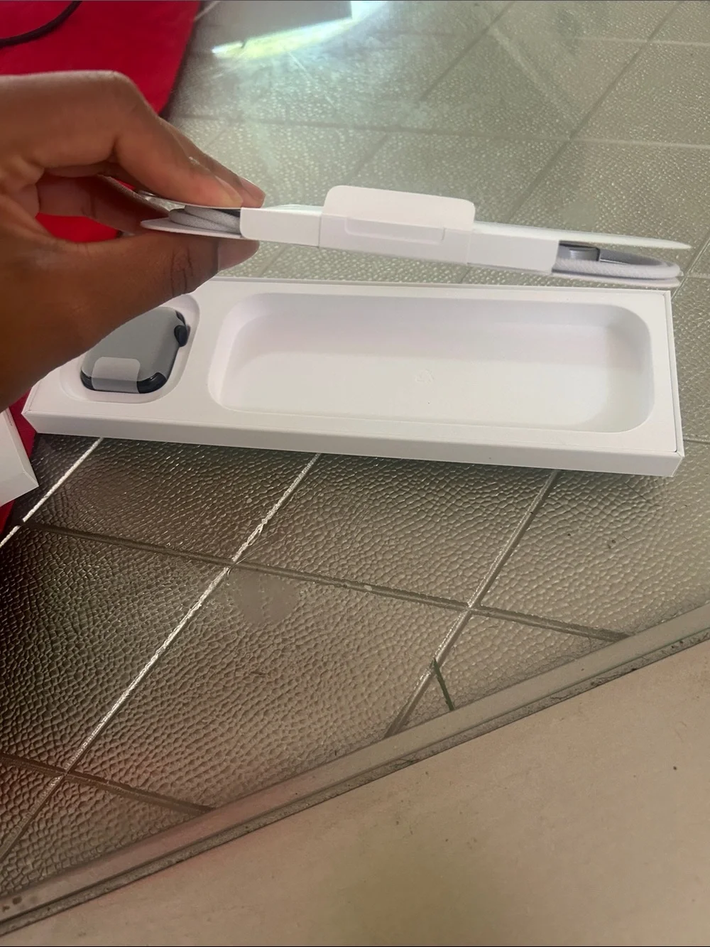Apple Watch with Black Sport Band in White Packaging